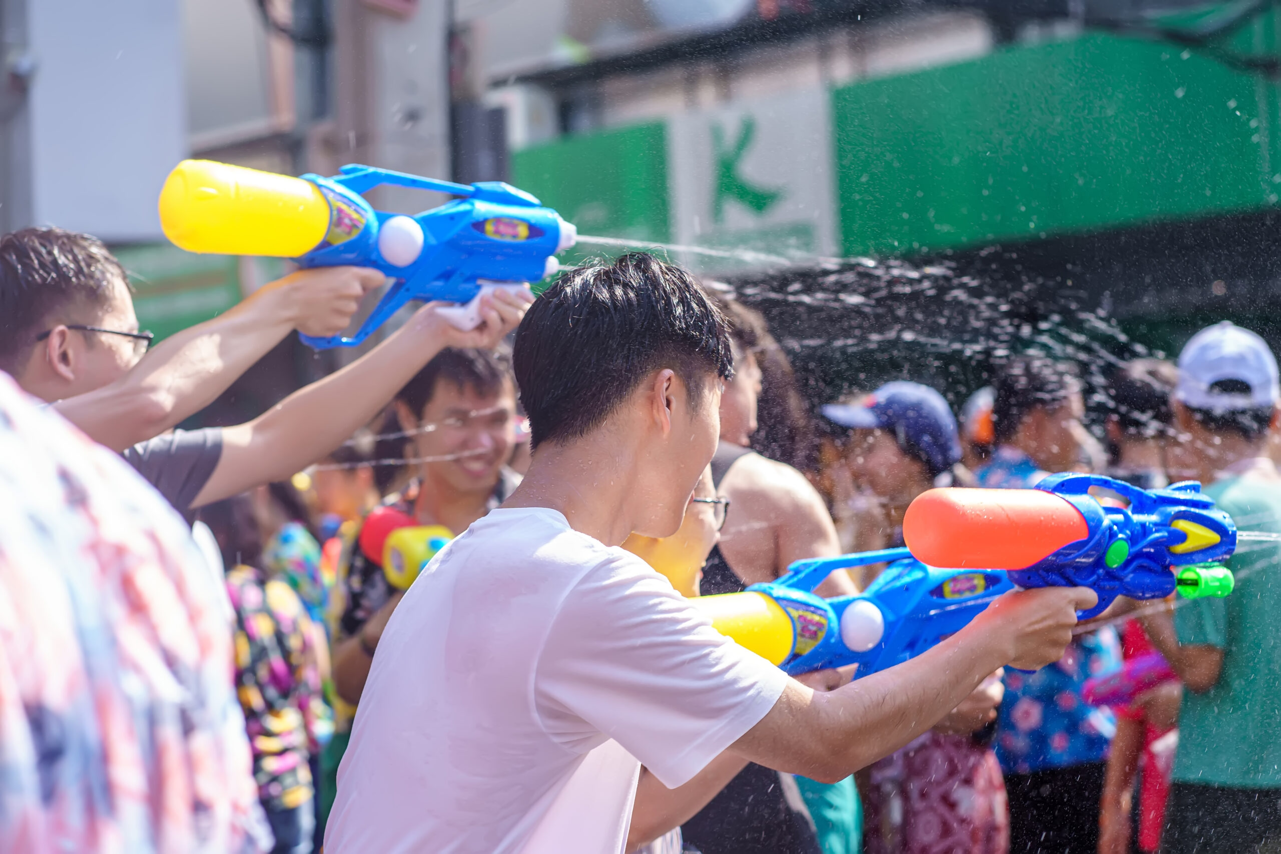 Siam Square, Bangkok, Thailand - APR 13, 2019: short action of people joins celebrations of the Thai New Year or Songkran in Siam Square.